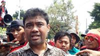Jokowi Resmi Teken UU Cipta Kerja, KSPSI dan KSPI Gugat ke MK